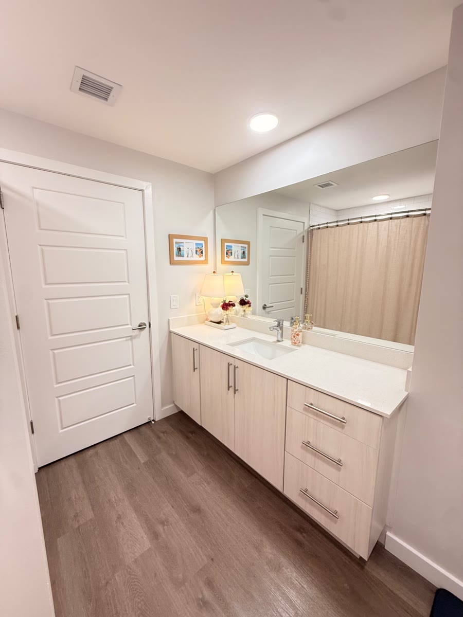 Bathroom vanity with a large mirror