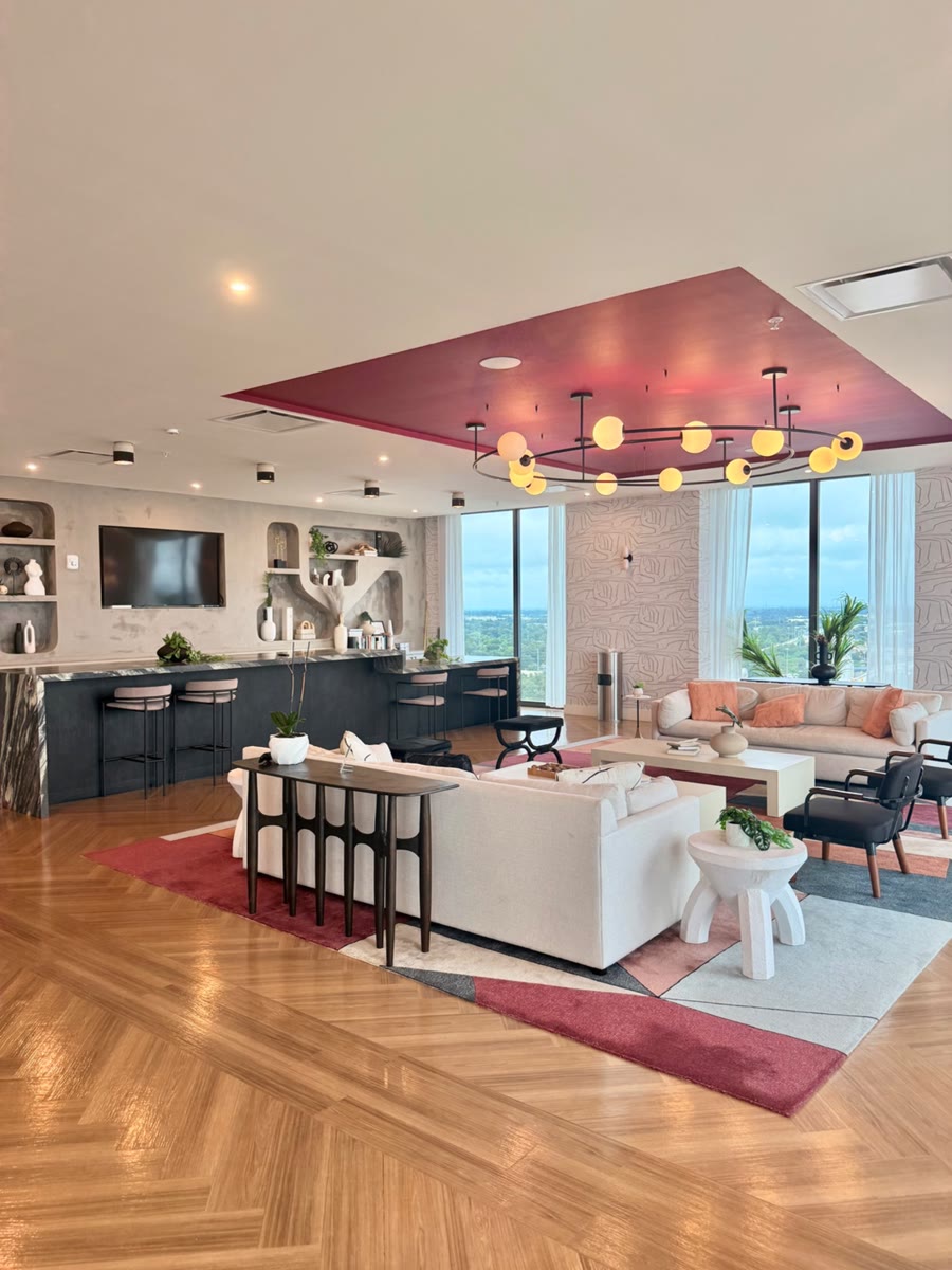 Sky lounge with a pink ceiling and globe chandelier