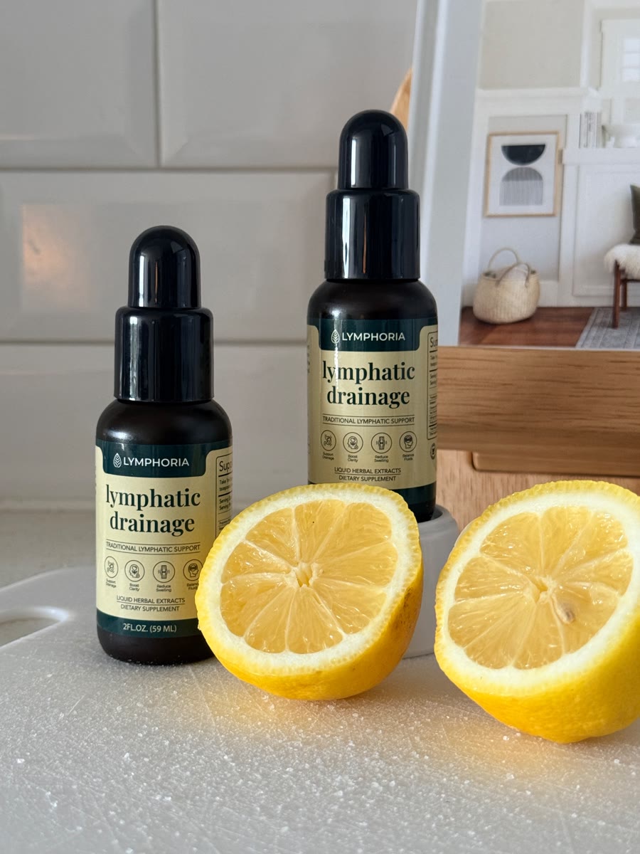 Two Lymphoria lymphatic drainage bottles with cut lemons